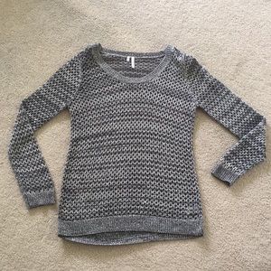 Grey fishnet-like knit sweater.